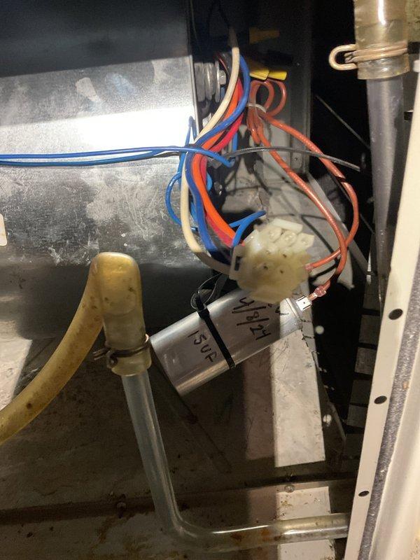 Osseo, WI - Responded to service call for 17-year-old forced air furnace producing loud noise and burning odor during startup. Diagnosed failed blower motor that was barely operational despite capacitors testing within specification. After evaluation, discussed with homeowners that this would be the second blower motor replacement and advised against continuing to replace components on aging equipment. Scheduled follow-up consultation to discuss repair versus replacement options for this two-zone system with single-stage furnace.