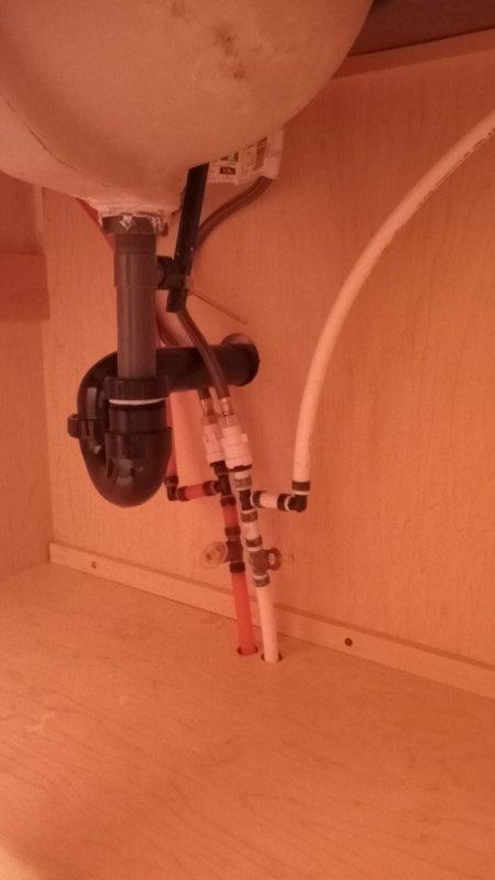 Diagnosed and resolved cold water supply issue in bathroom. Discovered leaking waterlines under the sink along with a compromised drain pipe. Repaired by reinstalling drain assembly and tightening a loose SharkBite fitting, restoring proper water flow and eliminating leaks.