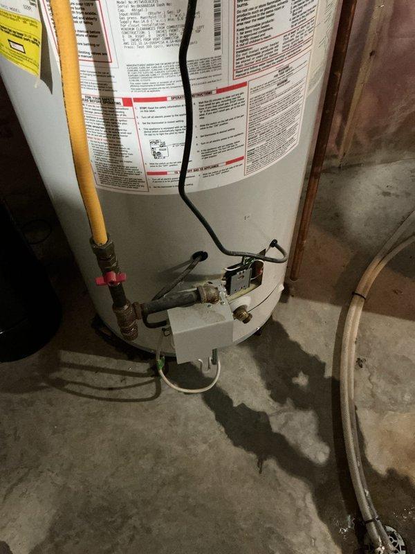 Responded to emergency service call for a leaking 40-gallon water heater with stuck shut-off valve. Upon inspection, determined the unit required full replacement due to bottom leakage. Installed new water heater, connected all necessary plumbing and gas lines, and verified proper operation with no leaks present. Water service to home was successfully restored.
