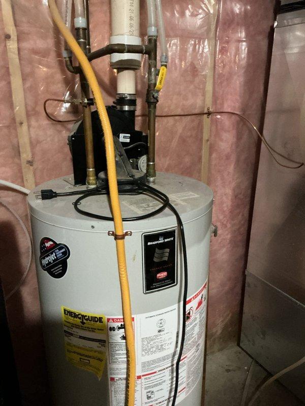 Responded to emergency service call for a leaking 40-gallon water heater with stuck shut-off valve. Upon inspection, determined the unit required full replacement due to bottom leakage. Installed new water heater, connected all necessary plumbing and gas lines, and verified proper operation with no leaks present. Water service to home was successfully restored.