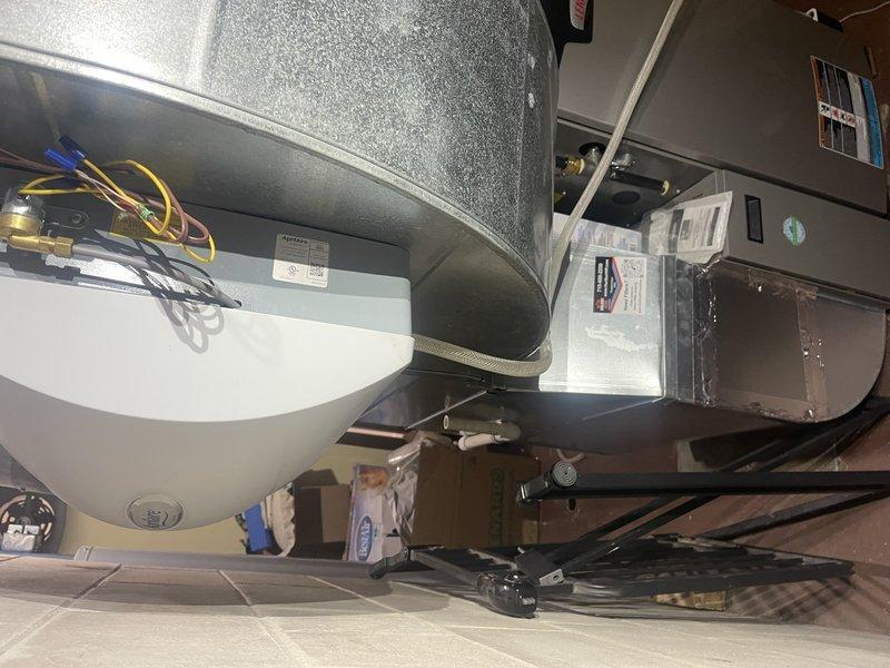 Installed Wi-Fi leak detector at customer's residence and reconfigured humidifier drainage system by implementing a single hose connection directly to the condensate pump. Set up safety shutoff mechanism to disable humidifier operation if pump fails to start, providing additional protection against water damage. All work completed successfully with photo documentation of the installation.