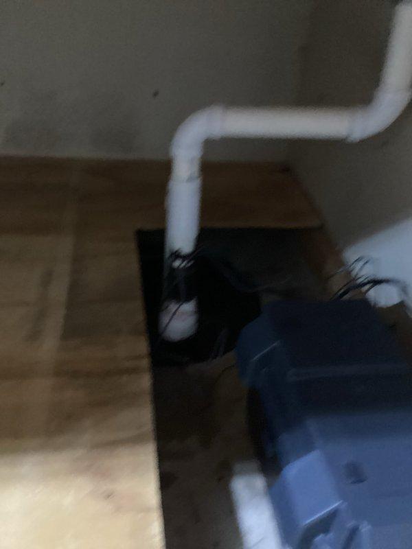 Responded to service recall for persistent sump pump alarm. Diagnosed water accumulation in the collection basin and replaced 10-year-old pump that was malfunctioning despite troubleshooting attempts. Installed new sump pump system with proper PVC drainage configuration to resolve the continuous alarm issue.