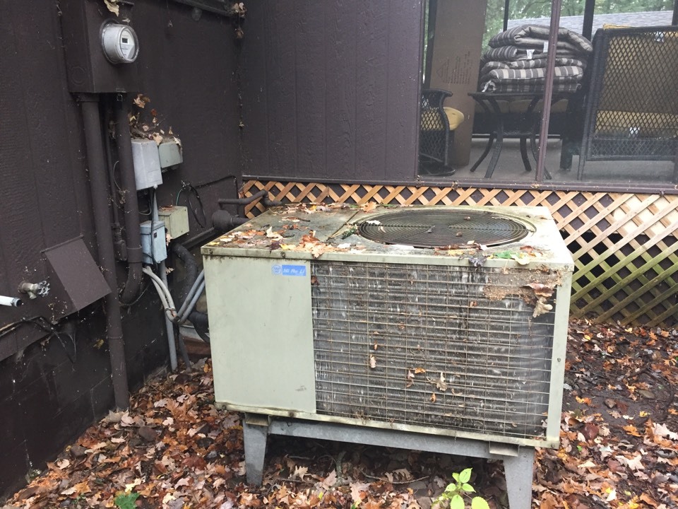 Lake Hallie, WI - About to replace this old Westinghouse air conditioner with a new Lennox heat pump that will save this family in Lake Hallie Wisconsin a ton of money!