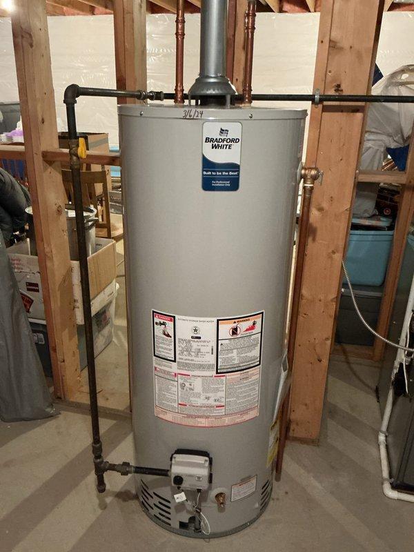 Inspected three Kohler toilets in customer's residence. Identified one toilet requiring replacement of flapper, fill valve, and supply line. Provided estimate for complete repair work including installation of new tank inserts for all three units. Additionally, assisted customer with kitchen drawer removal to enable access to under-sink plumbing. Documented existing water heater installation and noted significant corrosion on utility room piping system with evidence of water damage on concrete floor beneath.