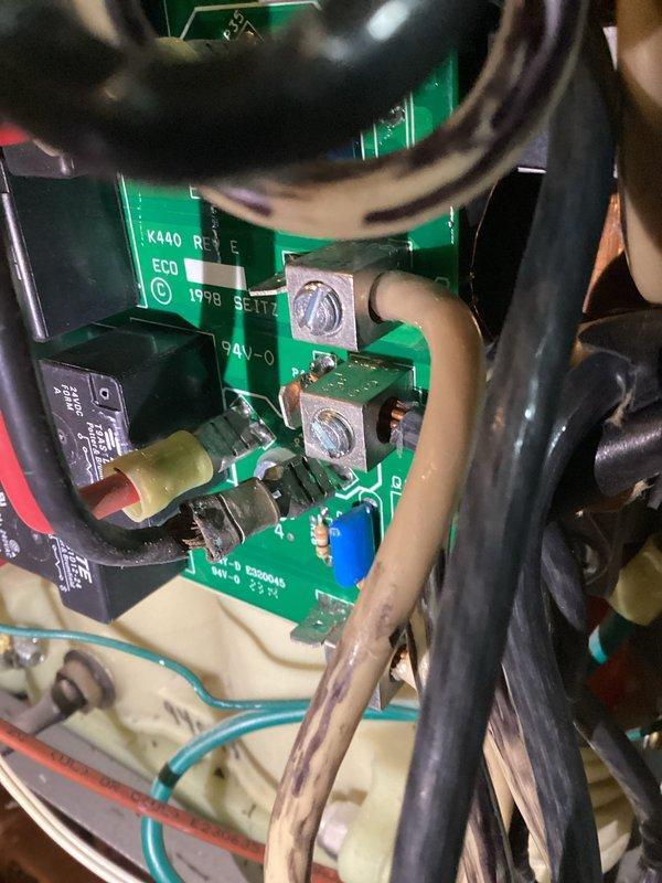 Diagnosed electric boiler system failure causing inadequate heating in floor heating zones. Inspection revealed a shorted heating element with visible burn marks on the circuit board and no response to heat calls. Documented damage with photos of the circuit board (Seitz board with 24V connections) and installed Marathon water heater system; prepared estimate for necessary replacement parts.