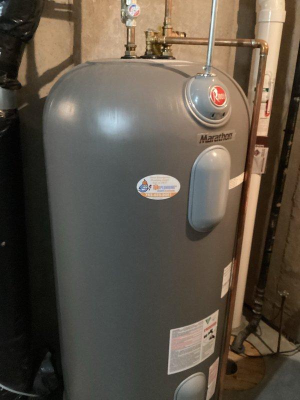 Diagnosed electric boiler system failure causing inadequate heating in floor heating zones. Inspection revealed a shorted heating element with visible burn marks on the circuit board and no response to heat calls. Documented damage with photos of the circuit board (Seitz board with 24V connections) and installed Marathon water heater system; prepared estimate for necessary replacement parts.