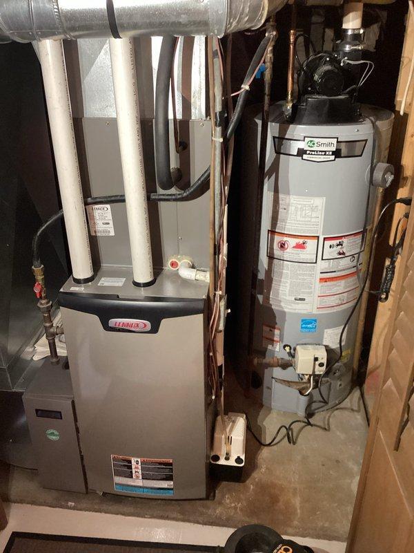 Durand, WI - Performed comprehensive gas furnace tune-up service on Lennox unit. Cleaned flame sensor and condensate system, thoroughly inspected heat exchanger for defects, and repaired leaking fernco connection that was causing condensation to drip onto furnace deck. Noted some staining behind blower area but no active leaks were identified.