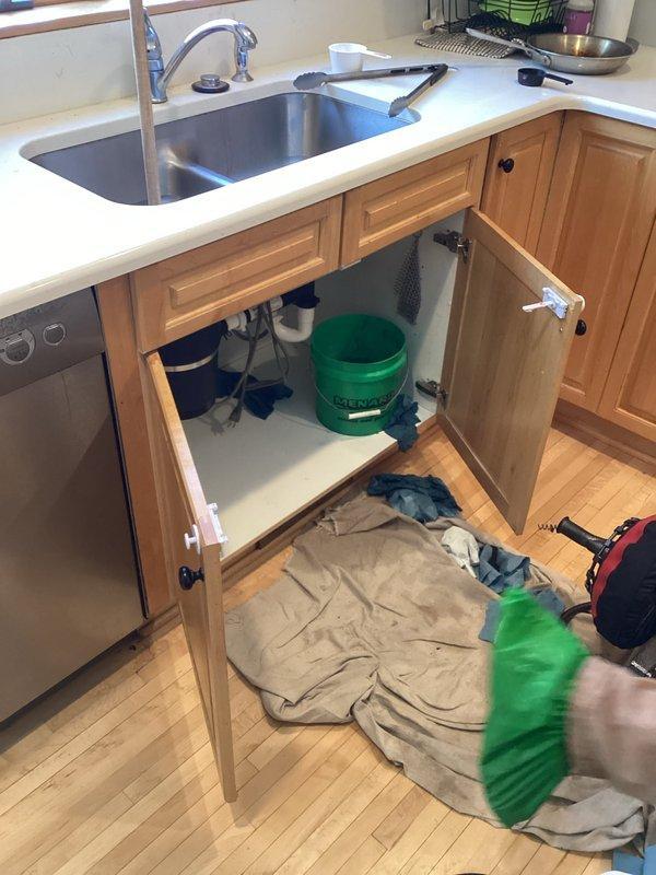 Responded to service call for clogged kitchen sink, deployed drain cable to clear blockage and restore normal drainage function. Protective drop cloth was placed during service to prevent water damage to cabinetry and flooring.