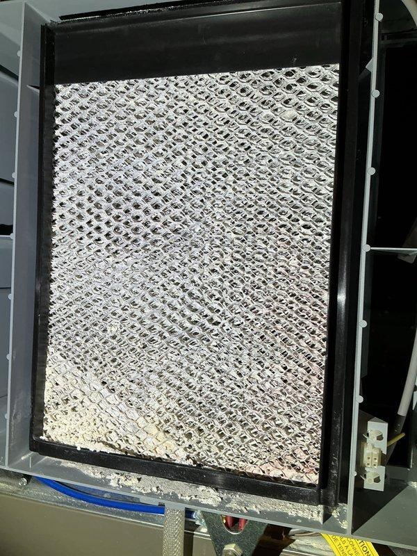 Completed comprehensive furnace tune-up and maintenance on single-stage gas heating system. Performed full system inspection including heat exchanger examination for wear and damage, combustion analysis testing, gas pressure verification, flame sensor and burner inspection, and blower motor/wheel assessment. Replaced 20x25x5 MERV 16 air filter and humidifier pad due to white powder buildup concerns. Cleaned and cleared pressure switch, verified thermostat operation and heating functionality. All components operating within normal parameters with no immediate repairs required.