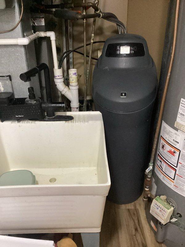 Responded to service call for non-functioning water softener system that was not regenerating or drawing salt from brine tank. Upon inspection, diagnosed issue as salt bridging causing blockage in brine tank system, preventing proper salt dissolution and brine draw during regeneration cycle. Provided estimate for repairs to restore water softener operation, including clearing salt blockage, inspecting brine line and float assembly, and testing regeneration cycle functionality.