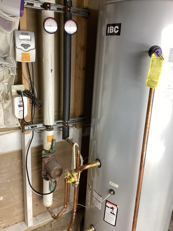 Responded to water leak from 80-gallon storage tank connected to solar water heating system. Upon inspection, found the temperature and pressure relief valve had failed, marking the second TP valve failure on this IBC storage tank since installation. Replaced faulty TP relief valve and tested operation. Due to recurring valve failures, recommended follow-up inspection of the solar thermal system to verify proper temperature regulation and ensure system pressures are not exceeding safe operating parameters, which may be causing premature TP valve failure.