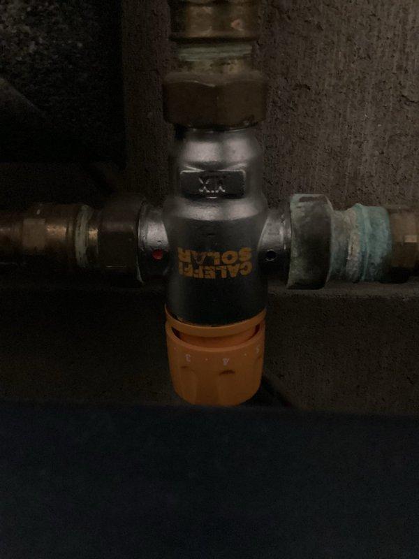 Responded to water leak from 80-gallon storage tank connected to solar water heating system. Upon inspection, found the temperature and pressure relief valve had failed, marking the second TP valve failure on this IBC storage tank since installation. Replaced faulty TP relief valve and tested operation. Due to recurring valve failures, recommended follow-up inspection of the solar thermal system to verify proper temperature regulation and ensure system pressures are not exceeding safe operating parameters, which may be causing premature TP valve failure.