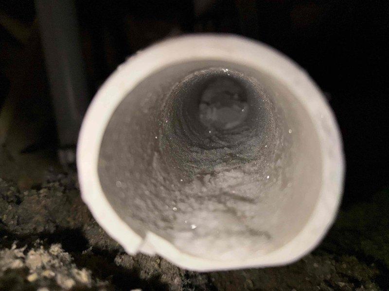 Responded to no heat call on recently installed furnace system. Upon inspection, discovered ice blockage in exhaust vent pipe preventing proper system operation. Cut out affected section of PVC exhaust piping where ice accumulation had formed and replaced with new pipe to restore proper venting and system functionality.