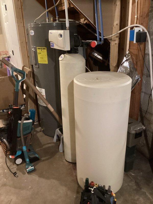 Responded to concern regarding suspected mold around furnace seal and cold air return on 25+ year old Lennox system. Upon inspection, determined that dark discoloration on black flex ductwork above furnace was accumulated dirt buildup rather than mold growth and posed no immediate concern. Performed maintenance including flame sensor cleaning and comprehensive heat exchanger inspection. Heat exchanger showed age-related rust spots with no visible cracks or compromises detected at this time. Documented findings with photos and reviewed condition with homeowner. Unit currently operating properly with normal ignition and heating function. Recommended monitoring system closely and considering replacement within next couple years due to age and early deterioration indicators.