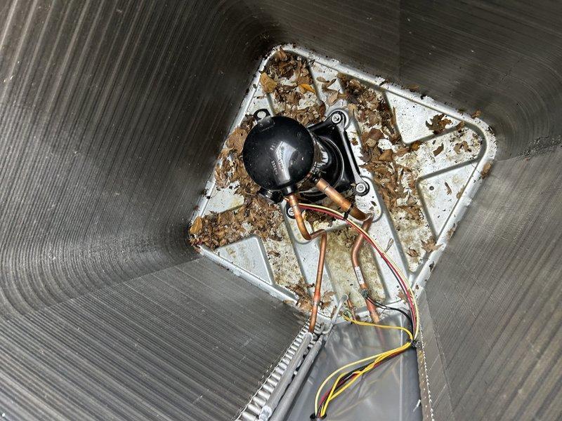 Performed comprehensive maintenance on Lennox EL297E furnace and ML17XC1 air conditioning system. Tested furnace operation and confirmed proper functionality. Homeowner reported condensate drainage issue from exhaust pipe 90-degree elbow in ceiling area; scheduled future appointment to address when access can be arranged. Verified air filter condition—found clean. Completed full inspection and cleaning of furnace components.

Transitioned system to cooling mode and measured temperature differential across evaporator coil—confirmed adequate cooling performance. Proceeded to outdoor unit for condenser inspection. Performed condenser coil cleaning to remove debris and restore optimal airflow. During electrical inspection, discovered loose capacitor terminals; tightened all electrical connections to manufacturer specifications. Measured operating amperage at 93.4 amps. All system components operating within normal parameters. Enrolled homeowner in rewards program for future service benefit