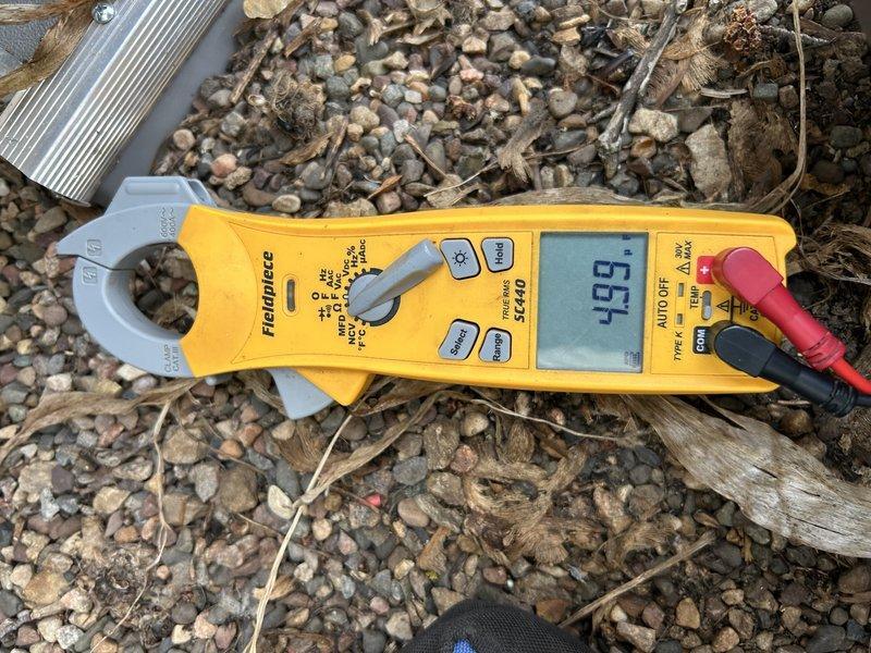 Performed comprehensive maintenance on Lennox EL297E furnace and ML17XC1 air conditioning system. Tested furnace operation and confirmed proper functionality. Homeowner reported condensate drainage issue from exhaust pipe 90-degree elbow in ceiling area; scheduled future appointment to address when access can be arranged. Verified air filter condition—found clean. Completed full inspection and cleaning of furnace components.

Transitioned system to cooling mode and measured temperature differential across evaporator coil—confirmed adequate cooling performance. Proceeded to outdoor unit for condenser inspection. Performed condenser coil cleaning to remove debris and restore optimal airflow. During electrical inspection, discovered loose capacitor terminals; tightened all electrical connections to manufacturer specifications. Measured operating amperage at 93.4 amps. All system components operating within normal parameters. Enrolled homeowner in rewards program for future service benefit