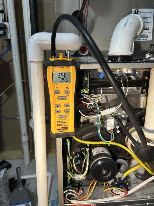 Completed furnace tune-up maintenance per annual service agreement. Performed comprehensive system inspection including gas pressure verification, heat exchanger examination, and carbon monoxide testing with all readings within normal parameters. Cleaned flame sensor, burners, and orifice; inspected supply/return vents. Noted potential heat loss issues due to 16+ foot ceilings and undersized system (50,000 BTU for 2,600 sq.ft home). Recommended dehumidifier installation to improve comfort on basement level.