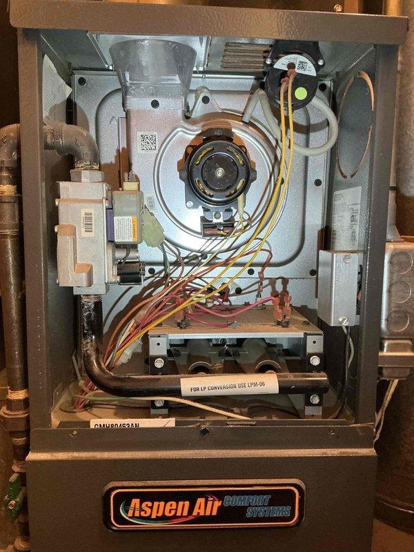 Conducted comprehensive tune-up inspection on 15-year-old Goodman furnace. Diagnostic testing revealed weakening blower capacitor, draft motor capacitor, and flame sensor; additionally observed dirty blower wheel and temperature stress on heat exchanger (no cracks or holes present). All other components, including igniter, motor amp draws, and combustion analysis, tested within manufacturer specifications. Customer informed of findings and maintenance options for landlord's consideration.