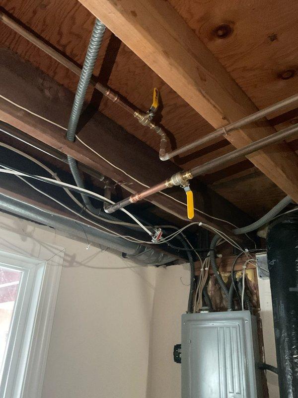 Repaired frozen/burst water supply lines in bathroom with minimal heat. Installed multiple ball valves at strategic points to allow for isolation of this section of the plumbing system, preventing future damage during cold periods when the bathroom isn't in use.