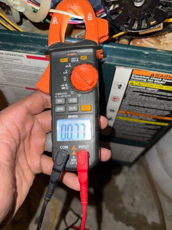 Performed furnace inspection on system of unknown age. Identified small crack in heat exchanger and reconnected condensate line that was leaking into cabinet. Conducted electrical diagnostics with clamp meter, measuring 0.77A draw. Customer plans to save through membership program for future system upgrade.