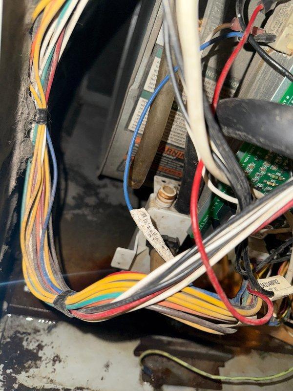 Performed furnace inspection on system of unknown age. Identified small crack in heat exchanger and reconnected condensate line that was leaking into cabinet. Conducted electrical diagnostics with clamp meter, measuring 0.77A draw. Customer plans to save through membership program for future system upgrade.