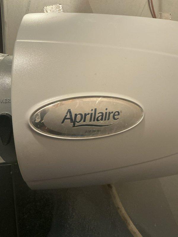 Responded to customer complaint of banging/bumping sounds from ductwork during heating cycle and issues with humidifier. Inspected Aprilaire 500 Series whole-home humidifier, found cracked tubing and plugged drain line causing leakage. Replaced humidifier tubing and water panel (pad). Unable to identify source of noise potentially coming from ducts despite thorough inspection.