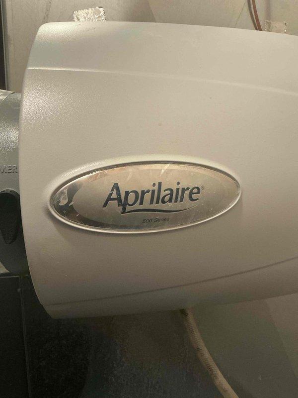 Responded to customer complaint of banging/bumping sounds from ductwork during heating cycle and issues with humidifier. Inspected Aprilaire 500 Series whole-home humidifier, found cracked tubing and plugged drain line causing leakage. Replaced humidifier tubing and water panel (pad). Unable to identify source of noise potentially coming from ducts despite thorough inspection.