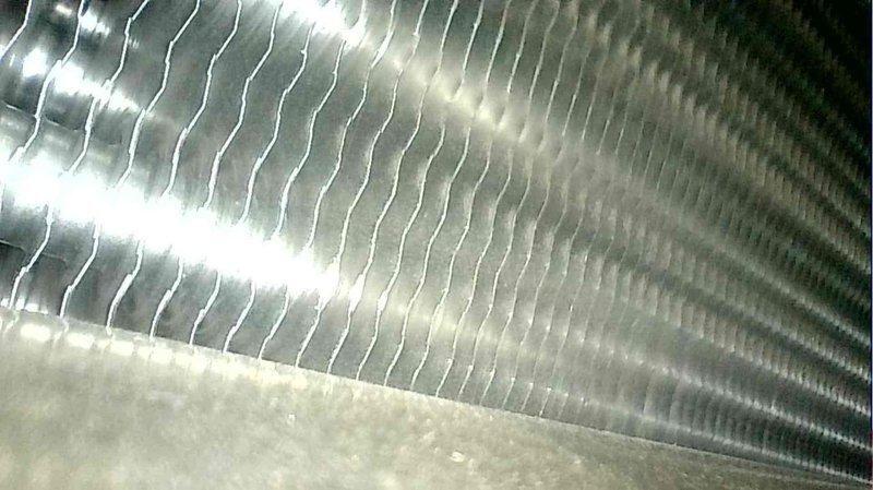 Performed scheduled furnace tune-up on 2-year-old unit. Inspected electrical components and connections, verified proper wiring integrity. Examined heat exchanger coils which were found in good condition with no signs of damage or buildup. System operating within normal parameters, no issues detected.