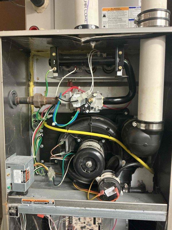 Performed comprehensive inspection on 11-year-old Payne furnace, testing all safety systems, controls, and components for proper function. Combustion analysis confirmed safe operation levels, though heat exchanger exhibits significant temperature stress consistent with age. Mini-split system (10 years old) reported as non-operational; documented condition with photos of furnace exterior and internal components.