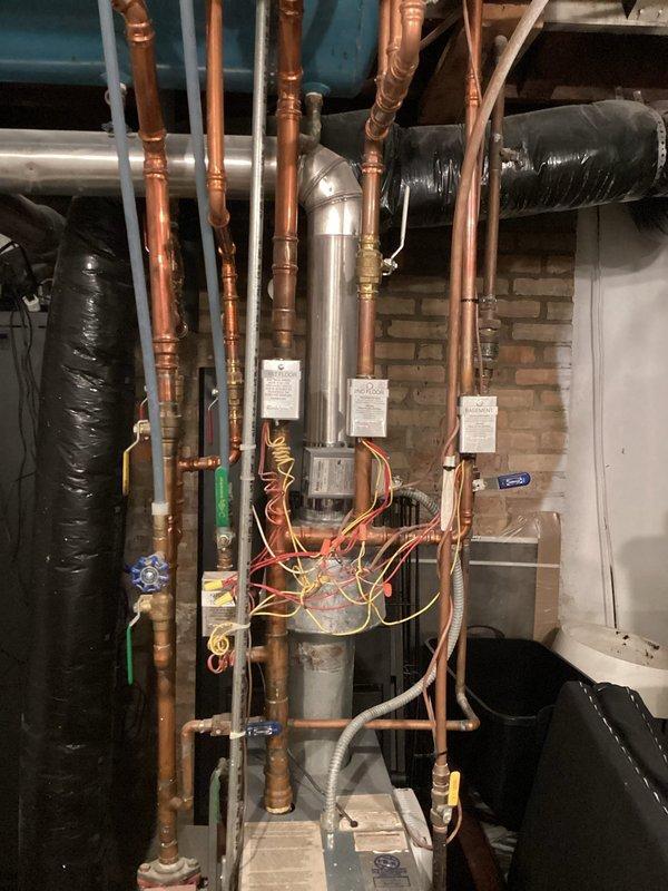 Responded to basement temperature inconsistency complaint with eco bee thermostat system controlling boiler and baseboard radiators. Discovered temperature discrepancy caused by averaging between thermostat and sensor readings; reconfigured system to read from thermostat sensor only and advised customer on potential need for further temperature adjustments.