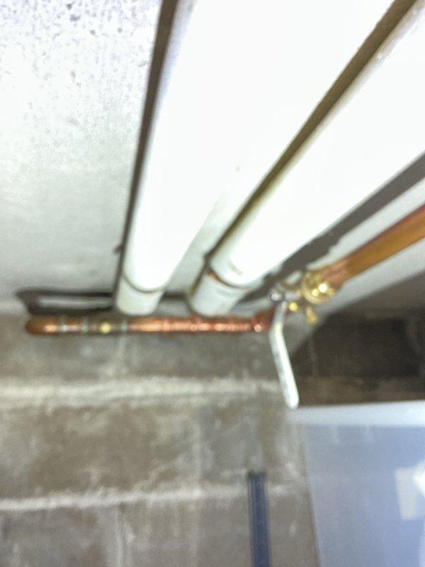 Completed comprehensive plumbing inspection with focus on water supply components. Identified and replaced defective laundry faucet, stops, and supply lines, as well as addressed leaking washing machine shut-off valve. Also inspected main street valve and bathroom fixtures, documenting the condition of existing plumbing infrastructure.