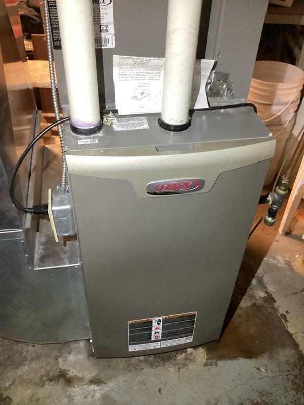 Responded to service call for water leaking from Lennox furnace. Diagnosed issue as non-operational condensate pump due to tripped GFCI outlet. Reset GFCI, verified proper pump operation through multiple test cycles, and confirmed normal system function. Inspected blower compartment, internal components, condensate drain lines, and pressure switches during troubleshooting.