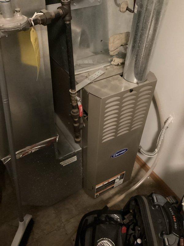 Diagnosed 22-year-old Carrier furnace with no heat issue caused by tripped high limit switch due to restrictive filter and potentially high gas pressure. Determined high limit switch is not resetting; ordered replacement part with 1-7 day lead time and scheduled return visit to replace high limit switch, calibrate gas pressure, and install less restrictive filter to resolve overheating condition.