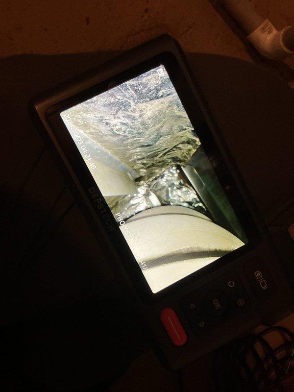 Performed routine maintenance on 19-year-old furnace and identified critical issues including oil leakage from blower motor and early signs of inducer motor failure. Used inspection camera to examine internal components and ductwork condition. Recommended replacement of both blower and inducer motors to prevent system failure and restore optimal performance.