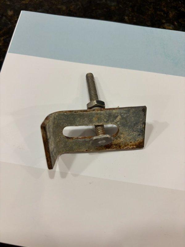 Responded to service call for undermount kitchen sink detachment from granite countertop. Inspected mounting hardware which showed significant corrosion on the L-bracket and threaded components. Re-secured double-basin stainless steel sink to countertop using replacement clamps and properly tightened mounting hardware. Completed installation of kitchen faucet.