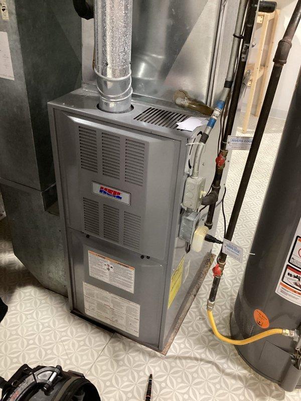 Conducted complete inspection on 21-year-old gas furnace. System burning safely with solid electrical connections. Identified and replaced out-of-range capacitor that would have caused operational issues. Verified clean filter and burners. Performed electrical testing with clamp meter showing 4.759 amp reading, confirming system is operating within normal parameters.