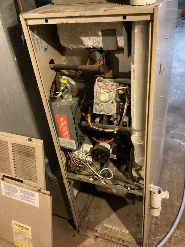 Responded to no heat complaint at rental property with older furnace system (exact age unknown). Upon diagnostic inspection, determined the blower motor had failed - evidenced by loud operational noise despite presence of flames. Recommended replacement of the motor and scheduled follow-up estimate for potential complete system replacement due to age of both units in property.