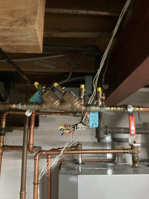 Responded to service call for an NTI combi boiler providing lukewarm domestic hot water despite adequate space heating functionality. Diagnosed issue with domestic water side of unit, performed full flush of holding tank to remove potential mineral buildup or sediment. After refilling and allowing proper heating cycle, system now producing appropriate hot water temperatures for all household fixtures.