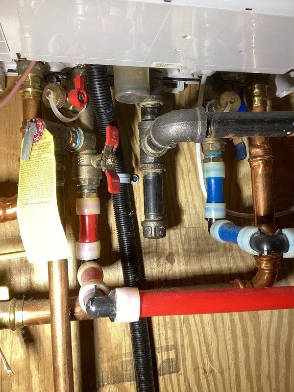 Performed Family Rewards maintenance visit on boiler system. Conducted comprehensive inspection including combustion air, ignitor, heat exchanger, water pressure/temperature, and zone board. Cleaned igniter and noted heat exchanger buildup recommended for cleaning next season. Identified damaged seal on condensate trap causing flue leakage; replacement recommended. System currently operating normally. Visual inspection of circulation pump (Taco Comfort Solutions 0015e3) and associated plumbing connections completed.