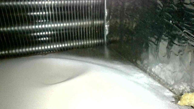 Responded to no heat call for 10+ year old FA furnace. Diagnosed clogged condensate drain line causing system shutdown. Cleaned drain line and inspected heat exchanger, noting moderate corrosion and rust formation. System restored to proper operation after service.