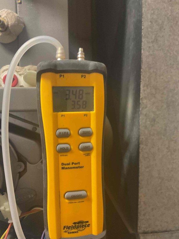 Performed comprehensive tune-up on natural gas furnace that was experiencing reduced cycling frequency. Diagnostic testing with Fieldpiece manometer showed pressure readings of 348/358, confirming issues with pressure switch and inducer. Cleaned dirty ports and serviced pressure switch components to restore proper operation. Electrical systems verified functional with multimeter testing.