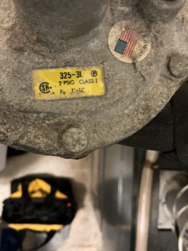 Responded to urgent service call for gas regulator failure. Upon inspection, confirmed the gas company had shut off and tagged the main gas supply due to regulator malfunction. Replaced defective gas regulator (325-3L, 2 PSG Class 1, Po 7"-11" CSA certified) to restore proper gas pressure to the furnace system, allowing safe resumption of heating service.