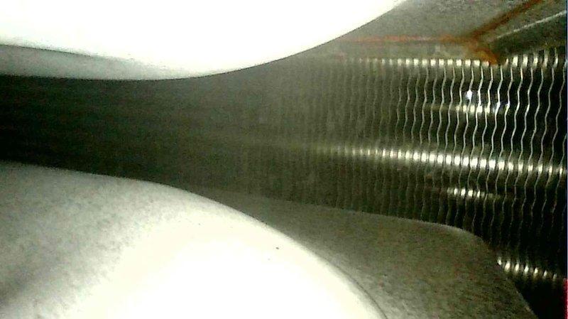 Performed scheduled furnace tune-up on Lennox system. Inspected and confirmed proper thermostat wiring connections at terminal block. Examined heat exchanger fins, which showed normal condition with no visible damage or debris accumulation. System operating within normal parameters; no issues identified.