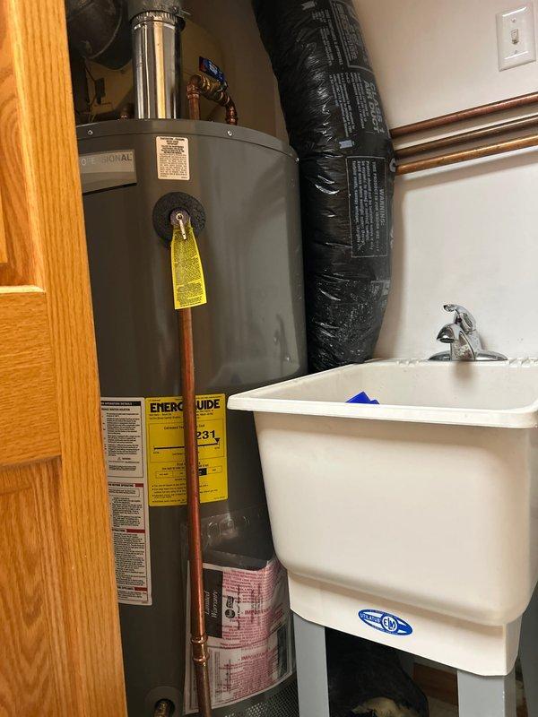 Responded to callback regarding water leakage near furnace installation. Diagnosed and resolved issue with condensate trap backup caused by debris and sediment buildup in PVC drain line. Cleared blockage from trap and drain line, restoring proper drainage function while confirming furnace is operating normally with no other issues.