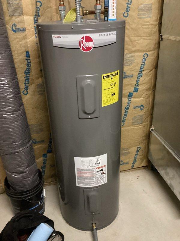 Woodbury, MN - Completed complimentary plumbing inspection and identified two issues requiring attention: downstairs shower cartridge showing signs of failure and downstairs toilet fill valve leaking from the top, causing water to escape from the tank. Also inspected Rheem water heater, which appears to be properly installed with standard copper pipe connections in utility area.