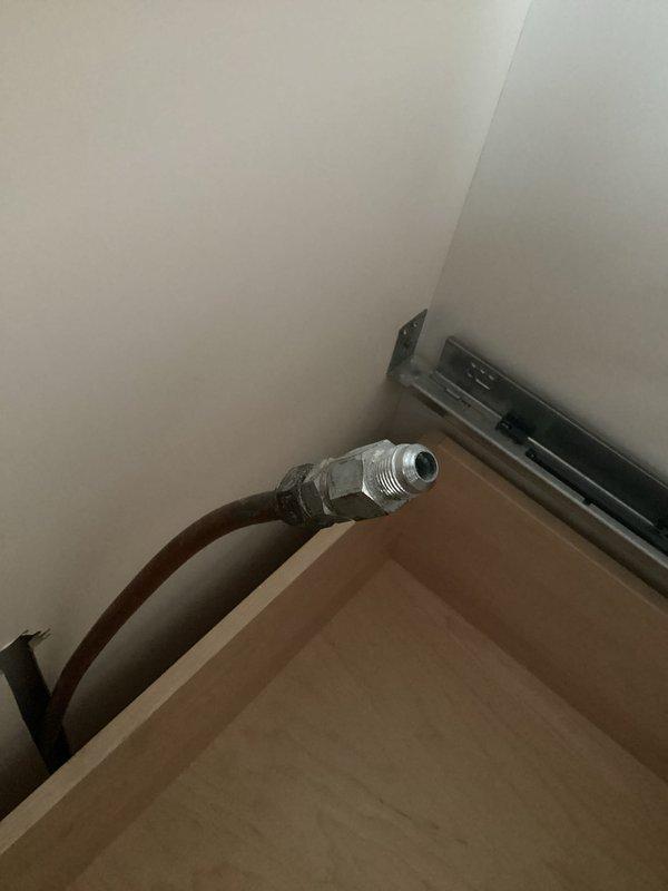 Installed gas ball valve and appliance connector for kitchen cooktop per project specifications. Completed installation of flare connector and shut-off valve as required. All connections were properly secured and tested for functionality.