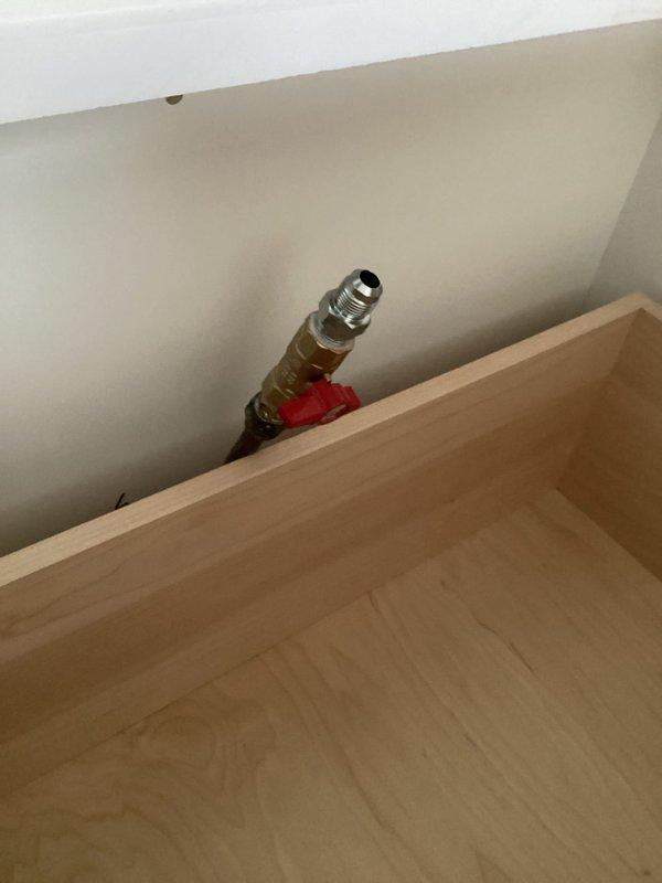 Installed gas ball valve and appliance connector for kitchen cooktop per project specifications. Completed installation of flare connector and shut-off valve as required. All connections were properly secured and tested for functionality.