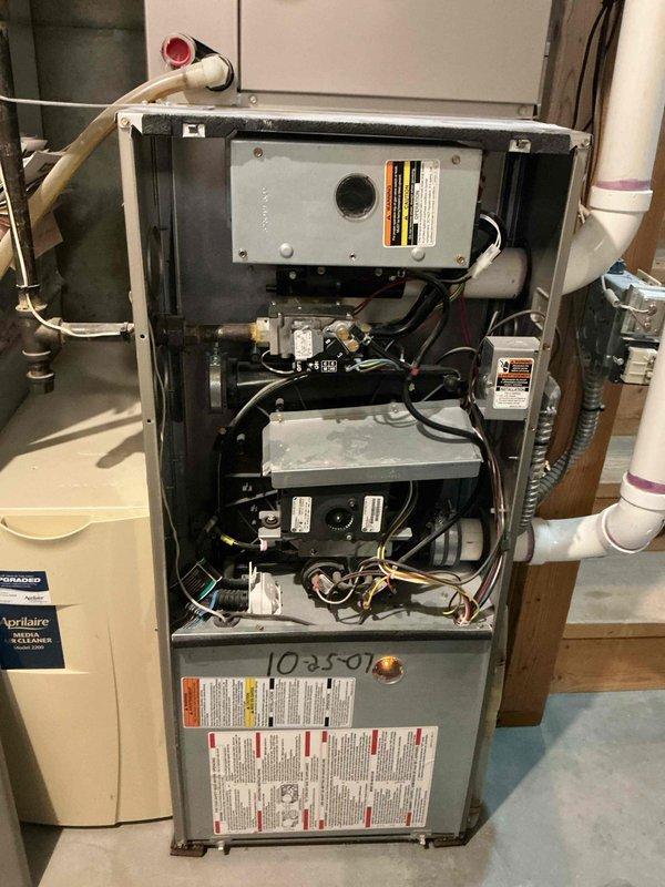 Responded to no heat call on 19-year-old residential gas furnace. Diagnosed intermittent voltage supply to inducer motor from control board. Attempted reconnection, but inducer motor failed to start. Due to age of unit, multiple component failures, and cost of repairs versus replacement, recommended and completed full furnace replacement.
