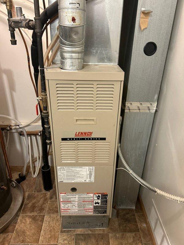 Completed routine furnace inspection on Lennox Merit Series system. Verified clean filter, good condition of flame sensor and ignitor, and solid electrical connections. Documented concerning condition of heat exchanger with photos, recommending annual monitoring. System burning safely at time of service.