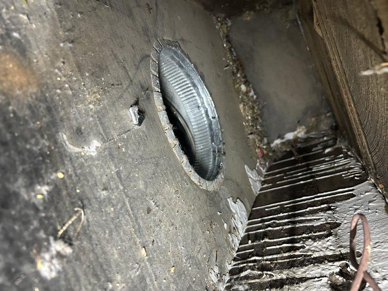 Responded to a no-heat call for an 80's era furnace blowing cold air. Upon arrival, system was locked out due to overheating with supply air temperatures approaching 150°. Diagnosed severely restricted airflow with almost 1" WC static pressure on return side and minimal static on supply side. Found only two functional returns throughout home, multiple closed vents, and heavy dust accumulation in ductwork. Reset system, opened basement vents, verified all supplies were open, and inspected burners (found crusty). Noted system using cooling wire on blower for heating due to furnace running hot. Verified proper gas pressure, correct orifice, and functioning blower capacitor.